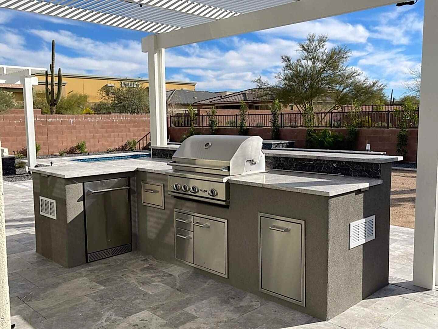 Outdoor kitchen with built-in grill.