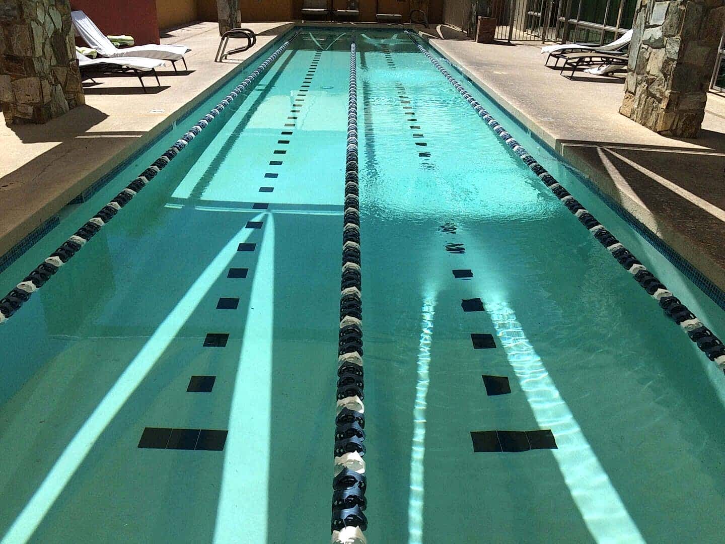 Empty lap pool with lane dividers.