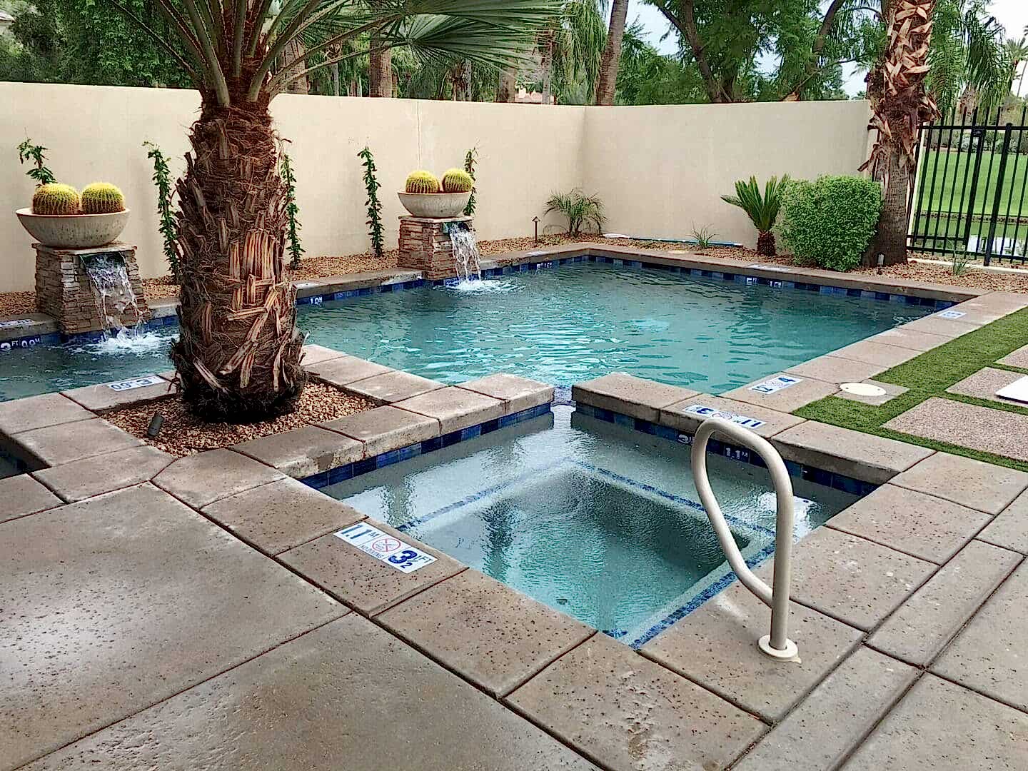 Resort pool and spa with fountains.