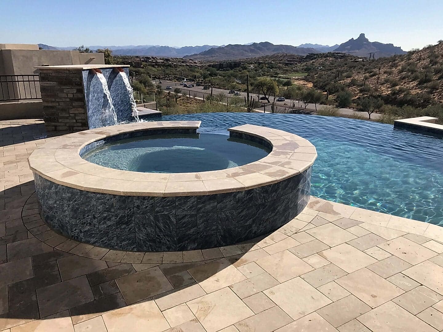 Luxury spa and infinity pool with mountain view.