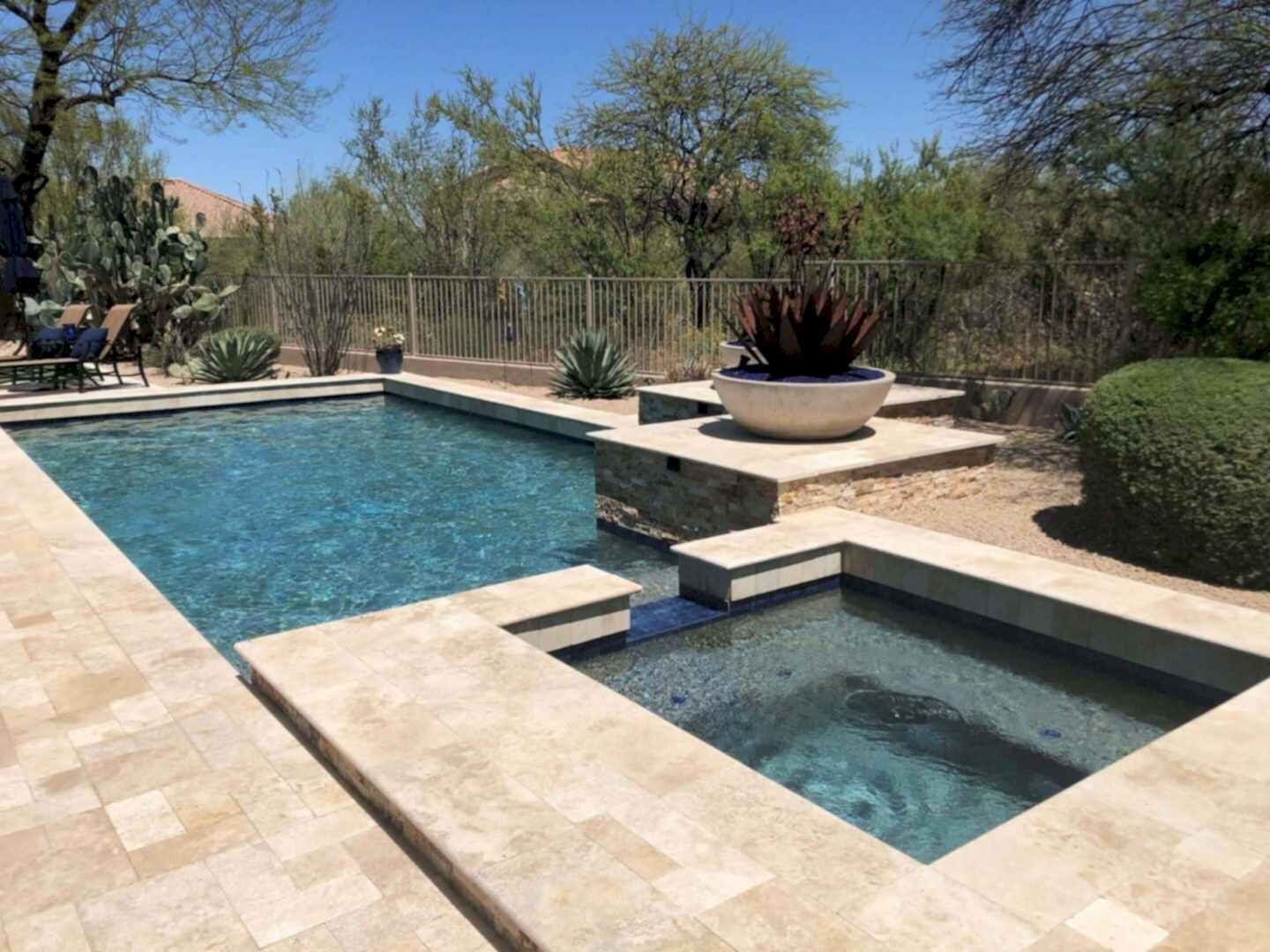 Luxury backyard pool and spa oasis.