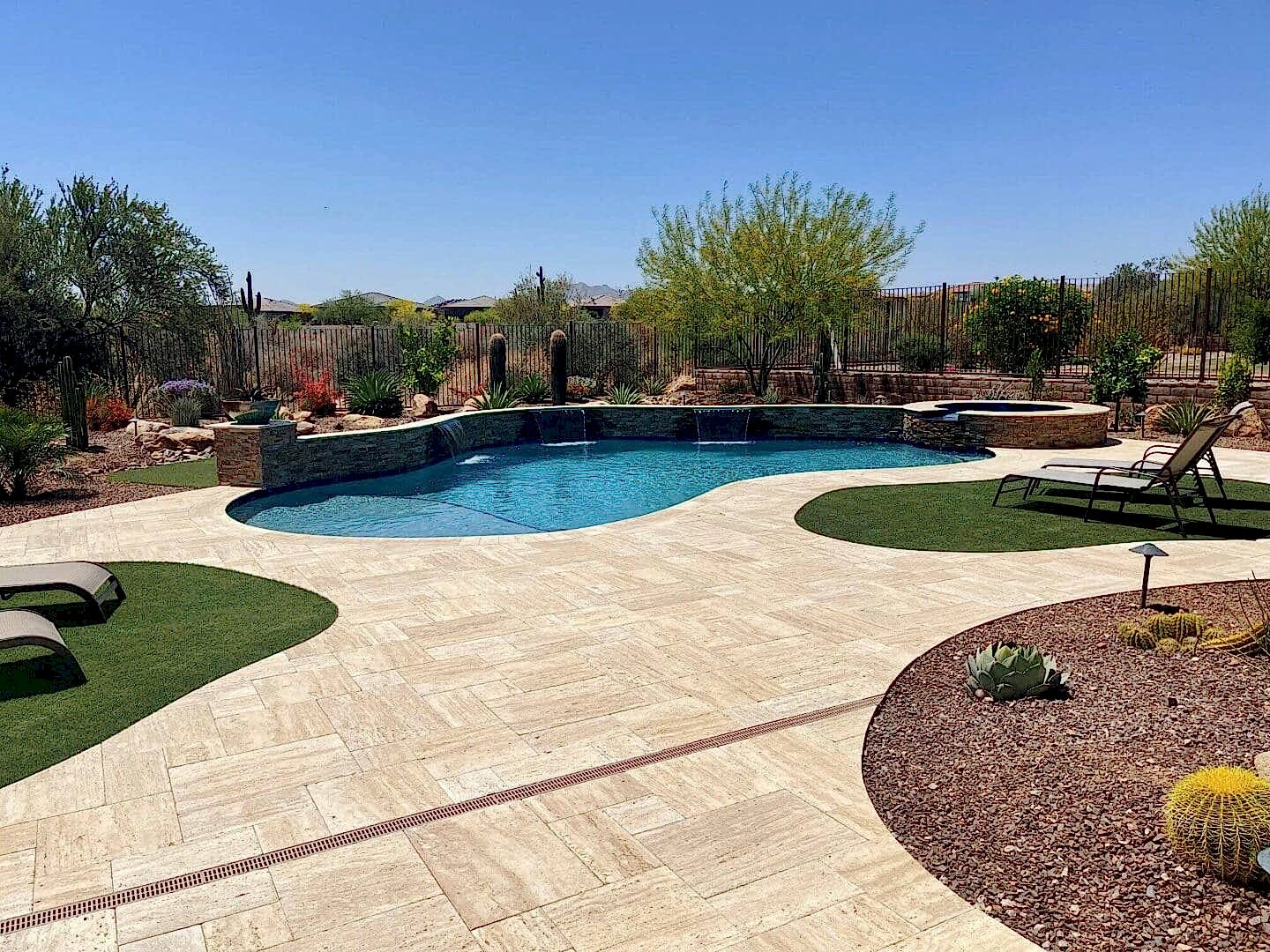 Here's an alt tag for the image: Luxury desert pool and patio.